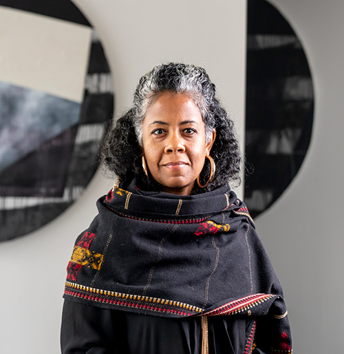 The artist Torkwase Dyson with installation *Nautical Dusk*, 2018. Photo by Gabe Souza courtesy of the Colby Museum of Art.